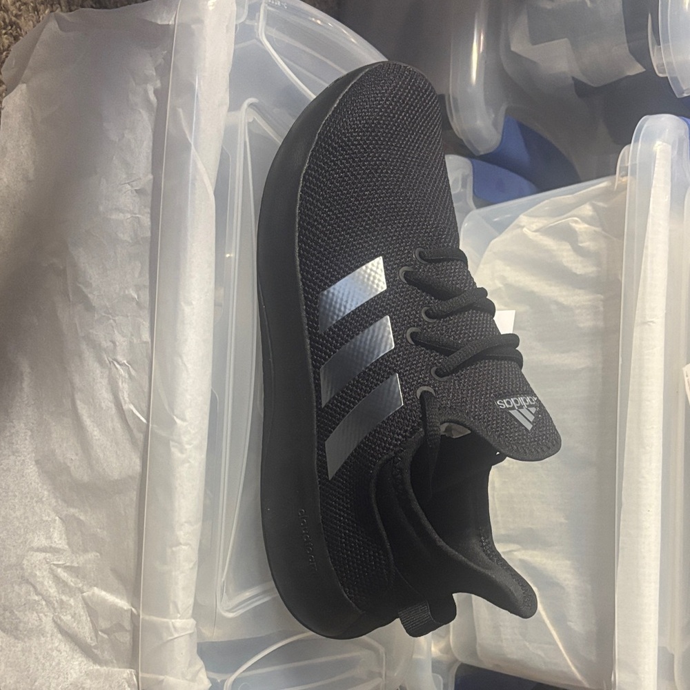 Adidas women’s Black Sneakers with Silver Stripes